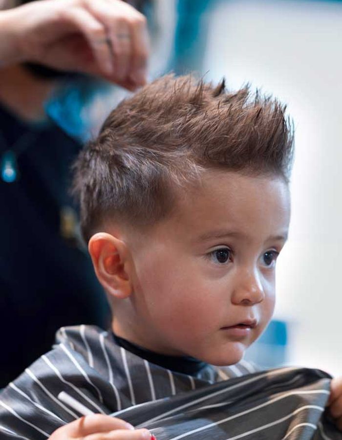 A boy with a freshly styled haircut